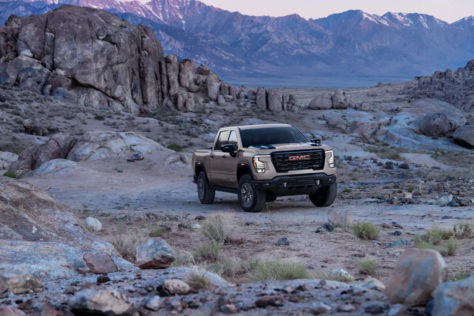 2027 GMC Sierra 1500 AT4X off-road pickup on a rocky trail