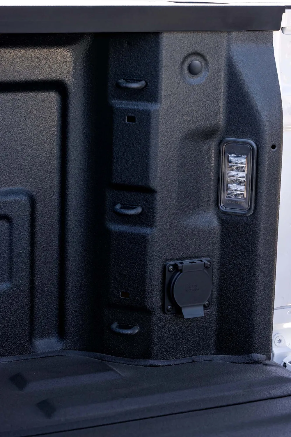 2027 GMC Sierra 1500 cargo bed tie-downs, LED bed light, and power outlet