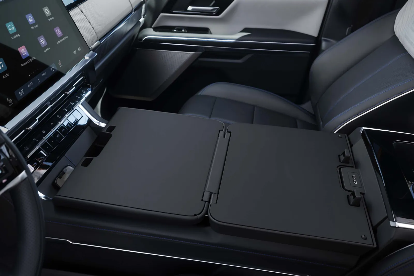 2027 GMC Sierra 1500 fold-out center console workspace with USB-C ports